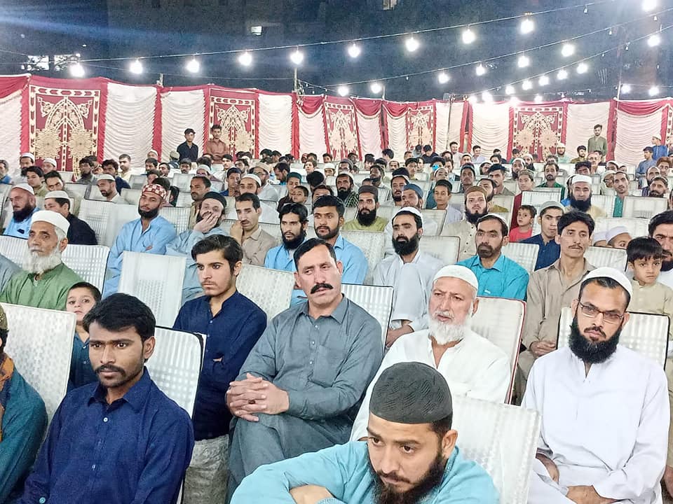 Person sitting in a modern building with a scenic view